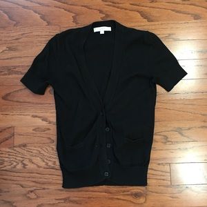 Short sleeved black cardigan.